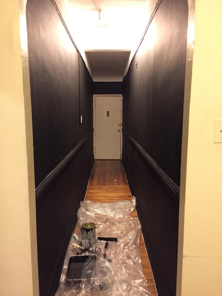 The hallway, now painted black in anticipation of the arrival of the museum's permanent collection.